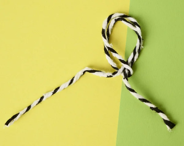 White Black Rope Green Background Twisted Loop Close — Stock Photo, Image