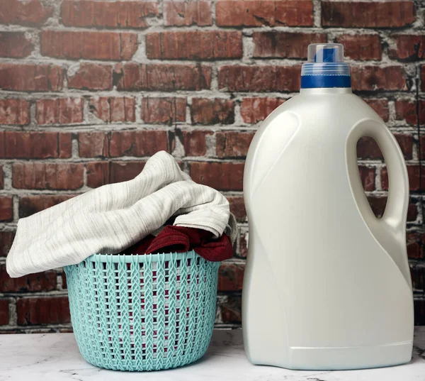 Plastic Laundry Basket Gray Bottle Liquid Laundry Powder Brown Brick — Stock Photo, Image