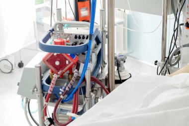 working ecmo machine in intensive care department clipart