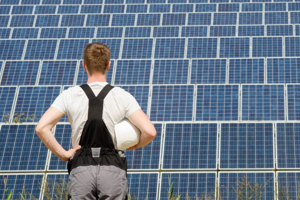 Solar panels engineer in white cask