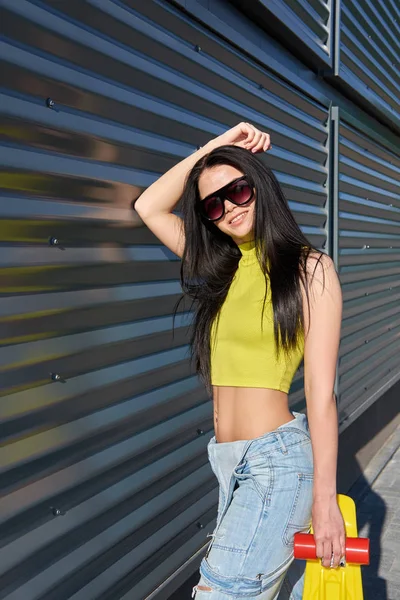 Portrait of positive young attractive girl wearing yellow top an — Stock Photo, Image