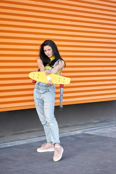 Portrait of positive young attractive girl wearing yellow top an — Stock Photo, Image