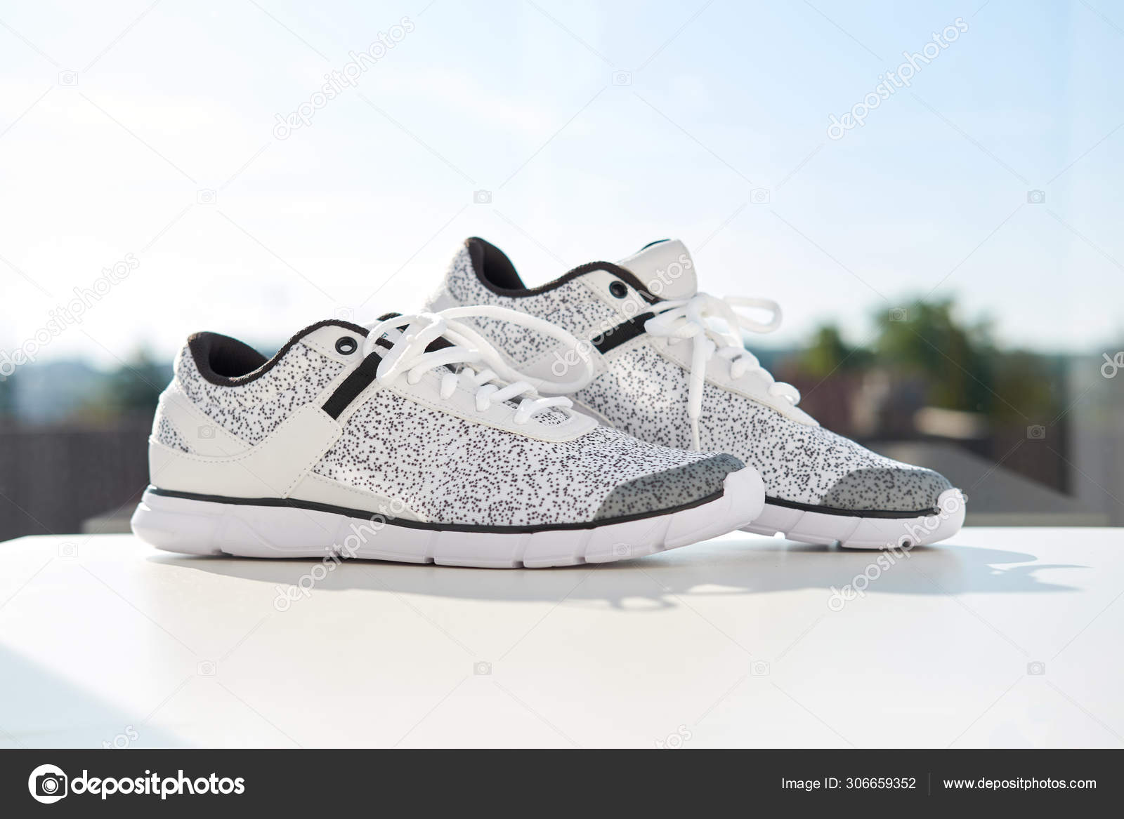 Stylish Fashionable Women's Sneakers Street Female Legs White Shoes Asphalt  Stock Photo by ©alonesdj 207784058