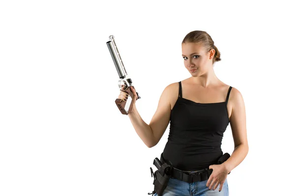 Young beautiful woman holding a gun on white background — Stock Photo, Image