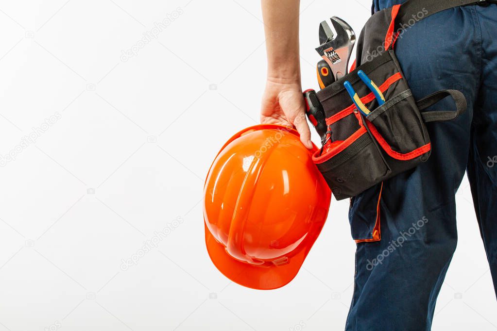 Construction belt on a man with diary notebook a pen tool belt builder pattern on a white background isolation. Close up view with copy space