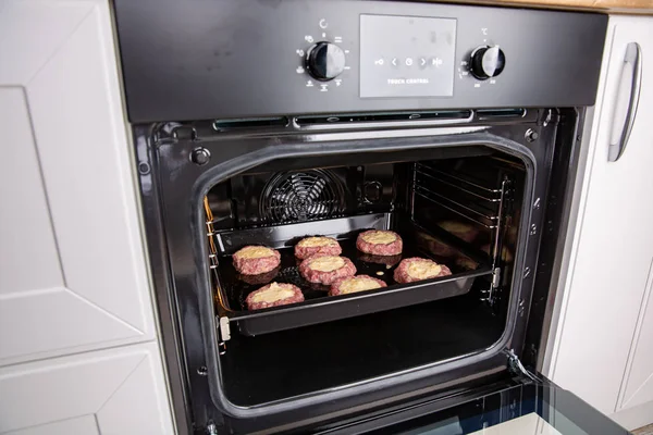 Fresh hot veal cutlet in fillo dough in the oven — Stock Photo, Image