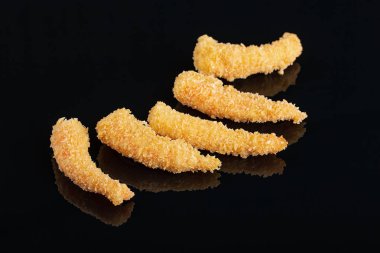Fried Shrimps tempura in black plate on dark concrete surface background. Seafood tempura dish clipart