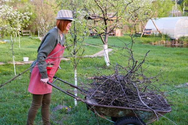 Woman working in garden in early spring