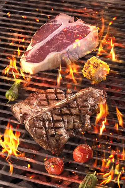 Meat and vegetables char-grilled over flame. B-B-Q Stock Picture