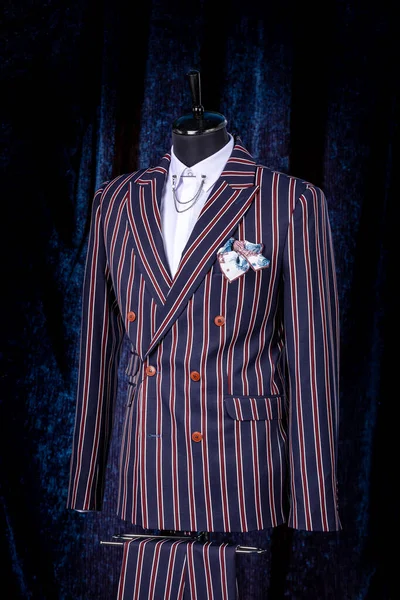 Mens business suit on mannequin, vintage color. elegant striped suit with pocket square