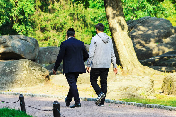 September 23, 2017. Uman,Ukraine. 2 man, the Hasidim Jews are walking in the park , the time of the Jewish New Year, Rosh Hashanah