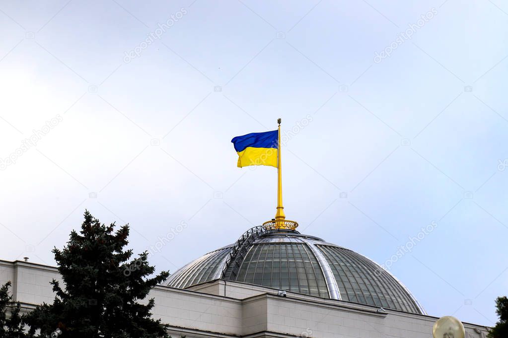 State national yellow blue Ukrainian flag on the dome of the Parliament of Ukraine, Verkhovna Rada, the capital city of Kyiv
