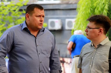 Dnipro city, Ukraine. June 15, 2018. Well-known mayor Boris Filatov talks to a city resident on the street. Filatov is a candidate for mayor of Dnepr in local elections in Ukraine 2020 clipart