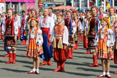 Dnipro, Ukraine, 13 09 2014. People in national Ukrainian costumes and embroidered shirts go to the City Day celebration. Ukrainian patriotism, patriots