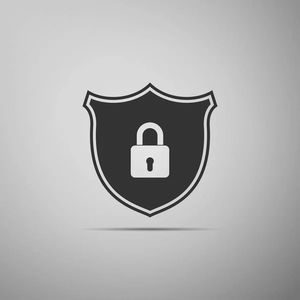 Seguridad del escudo con icono de bloqueo aislado sobre fondo gris. Diseño plano. Ilustración vectorial — Vector de stock