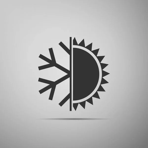 Símbolo frío y caliente. Icono de sol y copo de nieve aislado sobre fondo gris. Símbolo de invierno y verano. Diseño plano. Ilustración vectorial — Archivo Imágenes Vectoriales