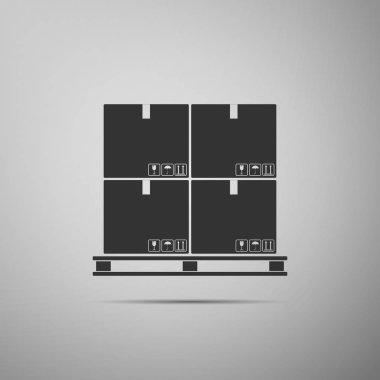 Palet simgesini gri arka plan üzerinde izole karton kutular. Kapalı karton teslim ambalaj kutu kırılgan işaretleri. Düz tasarım. Vektör çizim