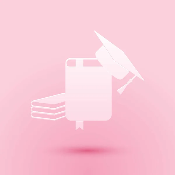 Corte de papel Tapa de graduación e icono del libro aislados sobre fondo rosa. Estilo de arte de papel. Vector — Archivo Imágenes Vectoriales