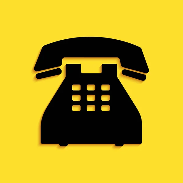 Zwarte Telefoon Pictogram Geïsoleerd Gele Achtergrond Vaste Telefoon Lange Schaduw — Stockvector