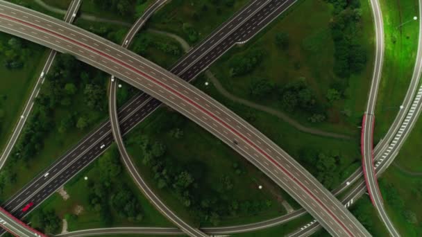 Top view modern asphalt multilevel road junction aerial shot many car fast moving on speed highway — Stock Video