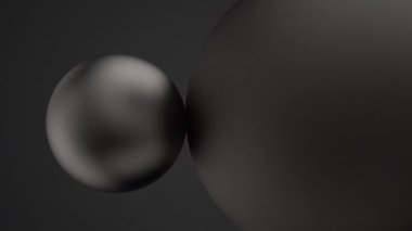 Birbirine dokunan iki siyah ve mat kürenin 3 boyutlu grafik animasyonu