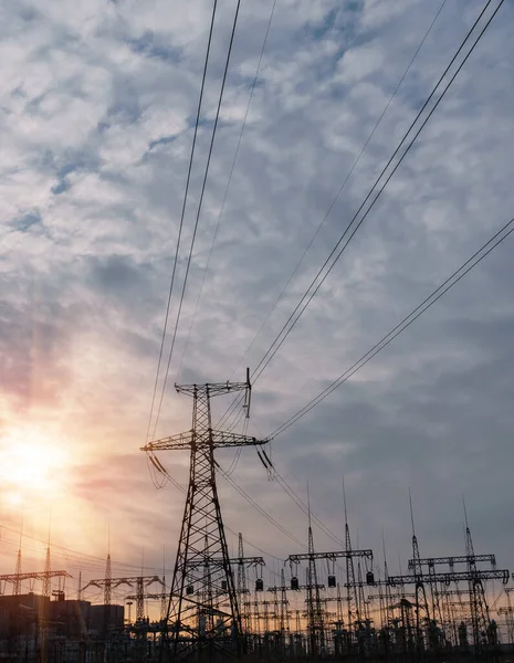 High-voltage  power lines. Electricity distribution station. high voltage electric transmission tower. Distribution electric substation with power lines and transformers.