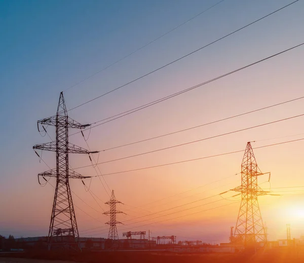 High-voltage  power lines. Electricity distribution station. high voltage electric transmission tower. Distribution electric substation with power lines and transformers.