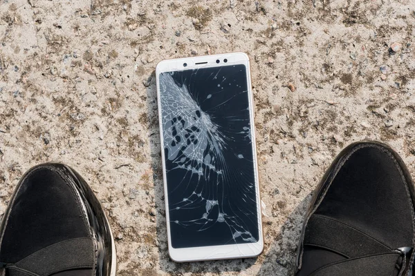 Smartphone with a broken screen. broken phone Close-up.