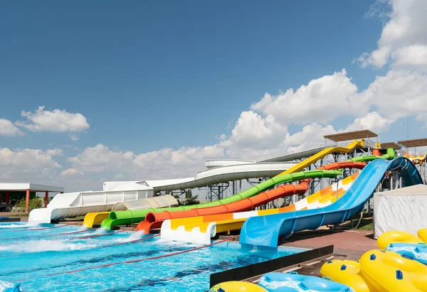 Water park with colorful slides and pools.