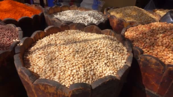 Different types of legumes are in barrels — Stock Video