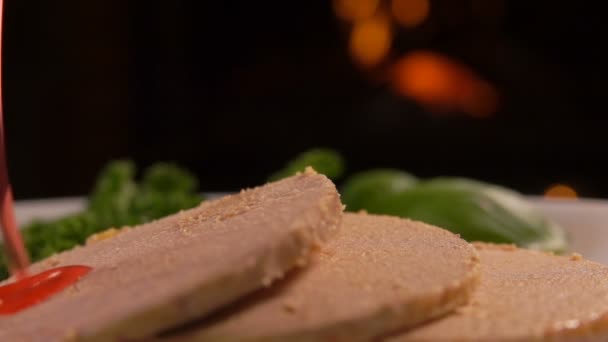 Close-up cowberry syrup pours into on foie gras — Stock Video