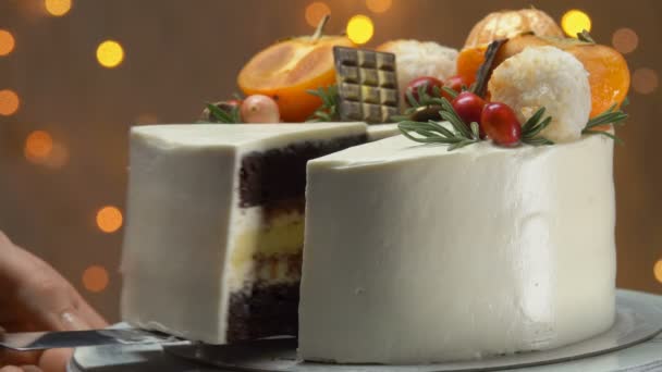Hand takes a piece chocolate cake with cheese souffle — Stock Video