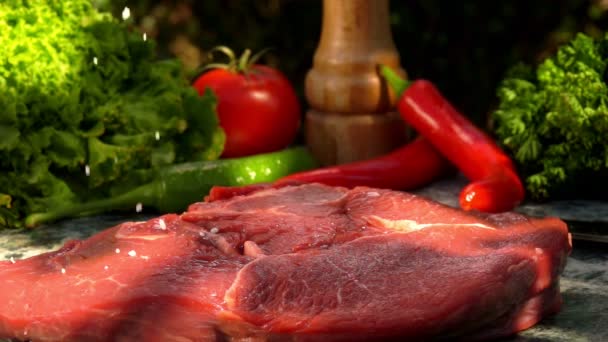 Veal steak sprinkled with coarse salt — Stock Video