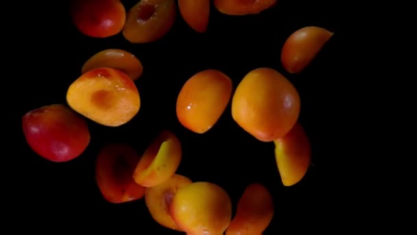 Halves ripe apricots bouncing against to the camera — Stock Video