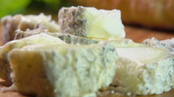 Cubes of Sainte maure goat cheese lying on plate — Stock Video