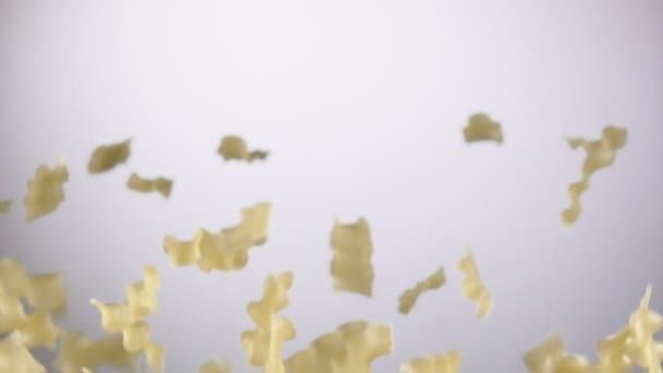 Pasta mafalde corte está voando para cima e girando em um fundo branco — Vídeo de Stock