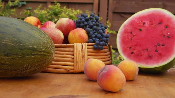 Panorama of delicious ripe watermelon, grapes, peaches and other fruits — Stock Video