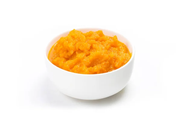 A bowl of carrot mud on a white background. — Stock Image Bowl Carrot Mud White Background Royalty Free Stock Images