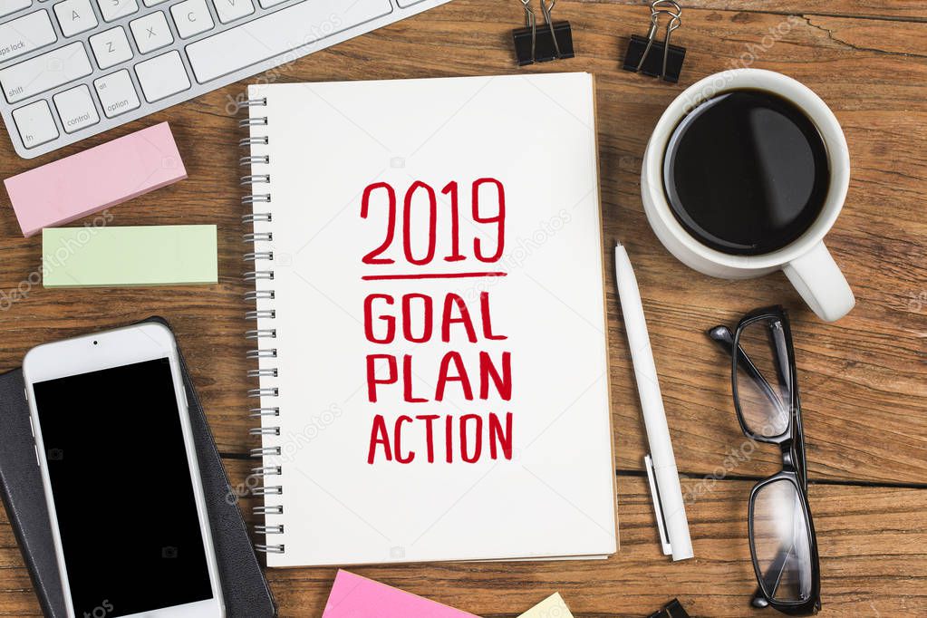 2019 new year goal,plan,action text on notepad with office accessories.Business motivation,inspiration concepts