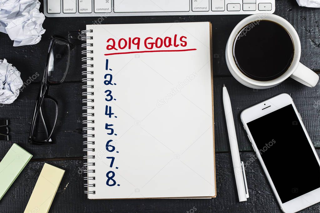2019 new year goal,plan,action text on notepad with office accessories.Business motivation,inspiration concepts
