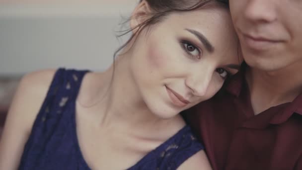 Man embracing woman in city sitting on bench in slow motion. Close up — Stock Video