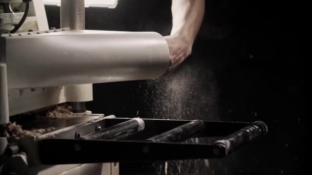 Man cleans wood machine from sawdust. Close up — Stock Video