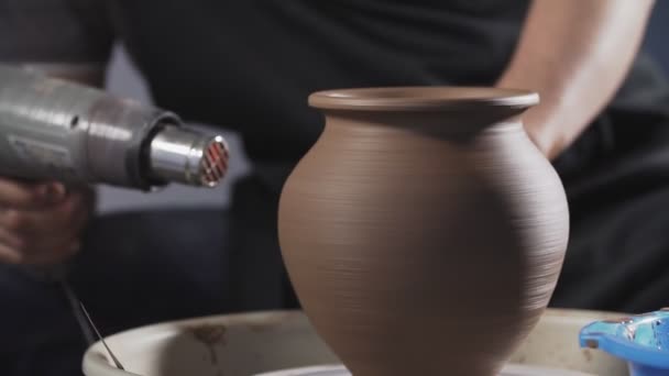 Potter dry clay jug with dryer. Man hands making clay jug. Handmade. Craft. — Stock Video