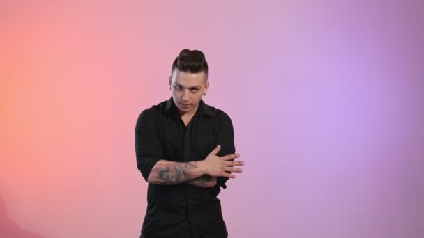 Portrait Handsome Tattooed Man Looking Camera Colorful Background Indoors Medium — Stock Video