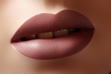Close-up Female Lips with Fashion Natural coffee Lipstick Makeup. Macro Sexy Lip Stick Make-up. Beauty shot clipart