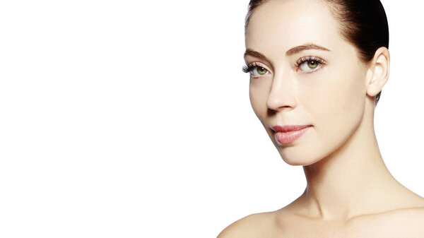 Beautiful face of young woman. Skincare, wellness, spa. Clean soft skin, healthy fresh look. Natural daily makeup.