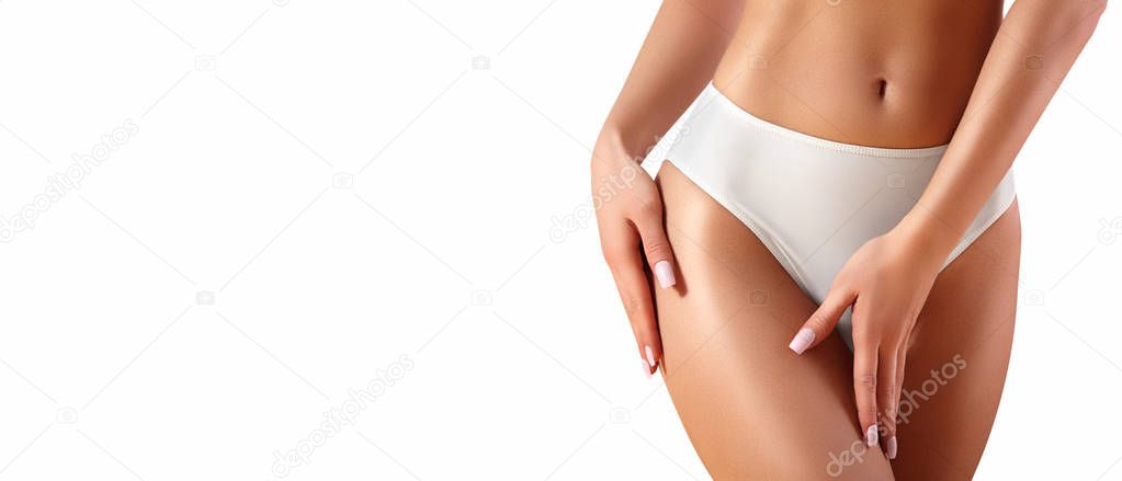 Spa and wellness. Healthy slim body in white panties. Beautiful sexy hips with clean skin. Fitness or plastic surgery. Perfect buttocks without cellulite.