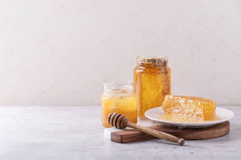 Honey in jar with honeycomb
