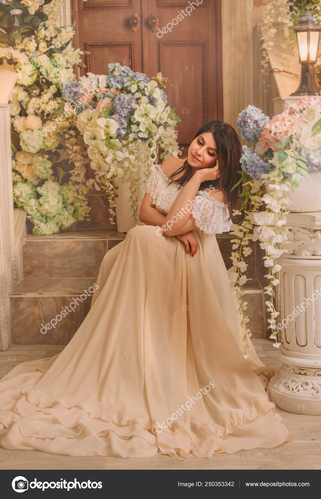 A Brunette Girl In A Cream Vintage Dress With Open Shoulders And