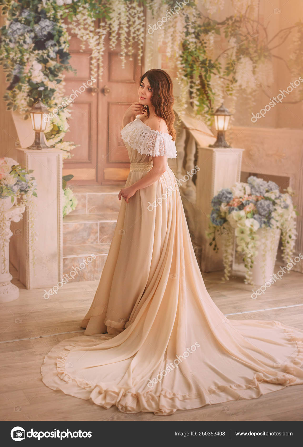 A Brunette Girl In A Cream Vintage Dress With Open Shoulders And